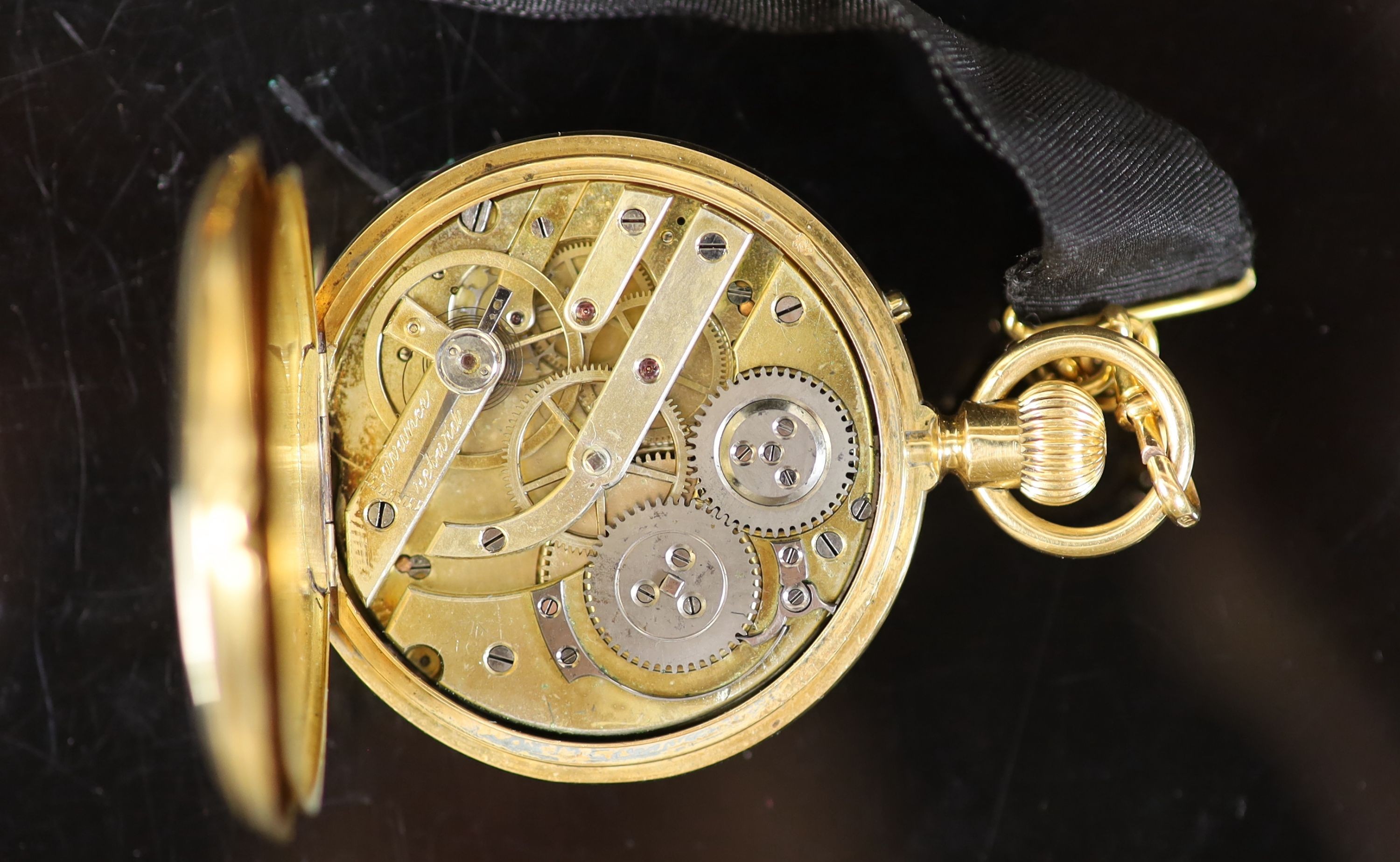 An 18ct gold full hunter keyless lever pocket watch, having white enamel Roman dial with subsidiary seconds dial, engraved monogram, on a 9ct mounted black silk ribbon, with 9ct and amber swivelling fob